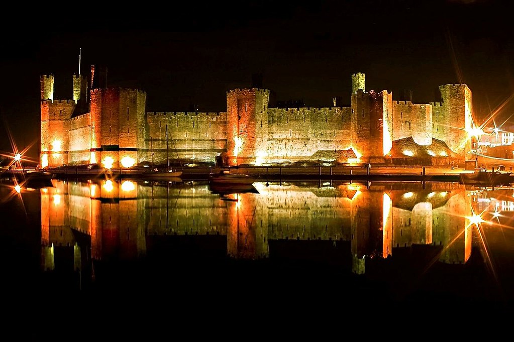 Caernarfon castle in calm conditions across the Seiont river. Credit Richard Outram