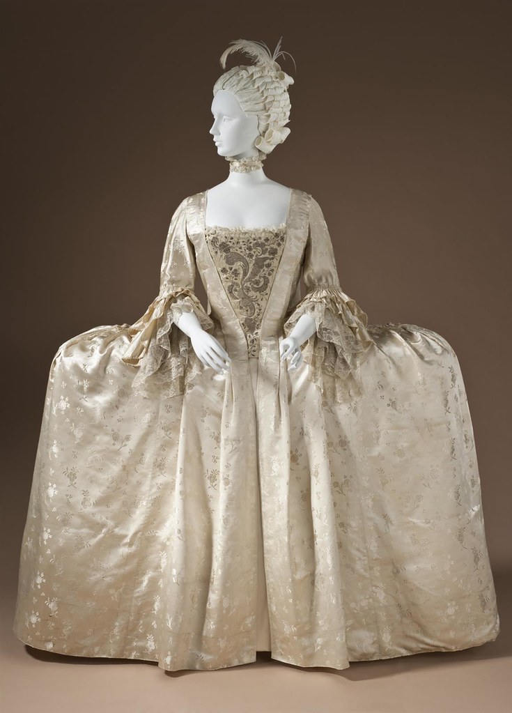 1765 Robe à la française. Silk satin with weft-float patterning and silk passementerie. LACMA