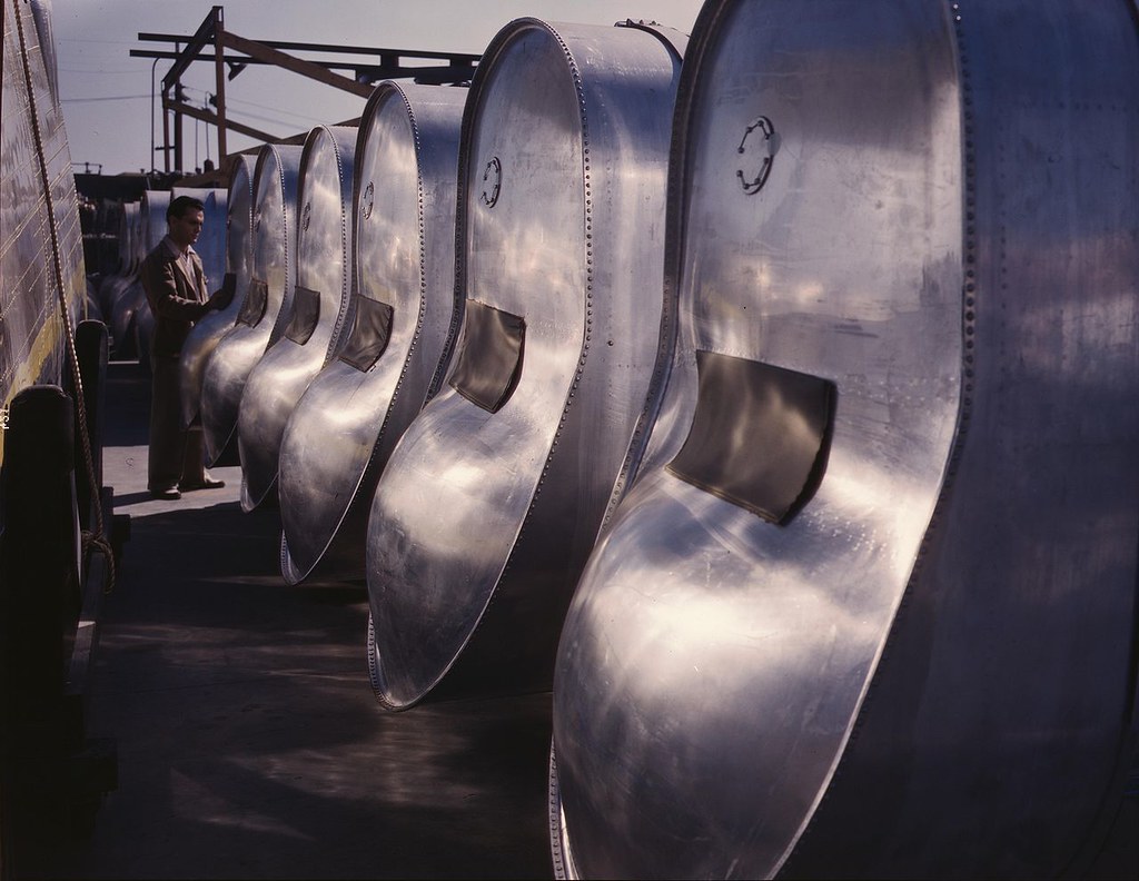 Bomb bay gasoline tanks for long flights of B-25 bombers await assembly in the plant of North American Aviation, Inc., Inglewood, Calif. This plant produces the battle-tested B-25 ("Billy Mitchell") bomber used in General Doolittle's raid on Tokyo, and the P-51 ("Mustang") fighter plane which was first brought into prominence by the British raid on Dieppe.