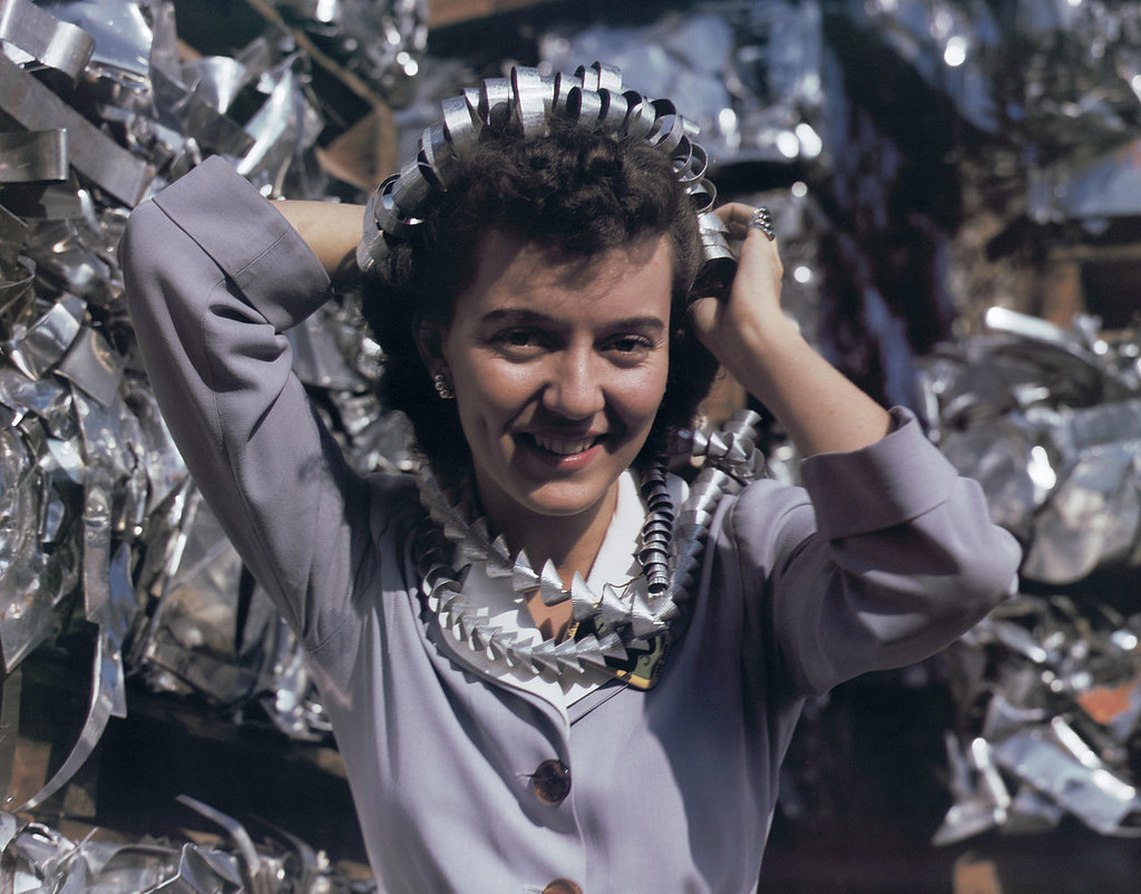 Annette del Sur publicizing salvage campaign in yard of Douglas Aircraft Company, Long Beach, Calif.