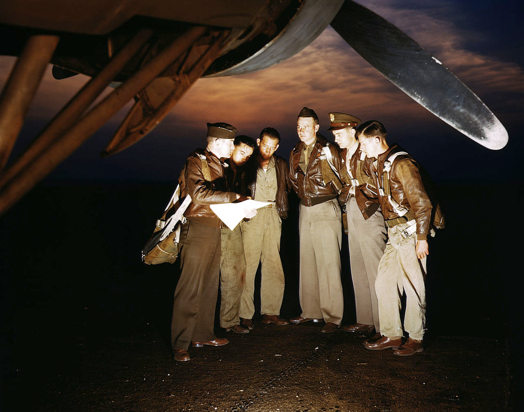 A combat crew receives final instructions just before taking off in a YB-17 bomber from a bombardment squadron base at the field, Langley Field, Va.