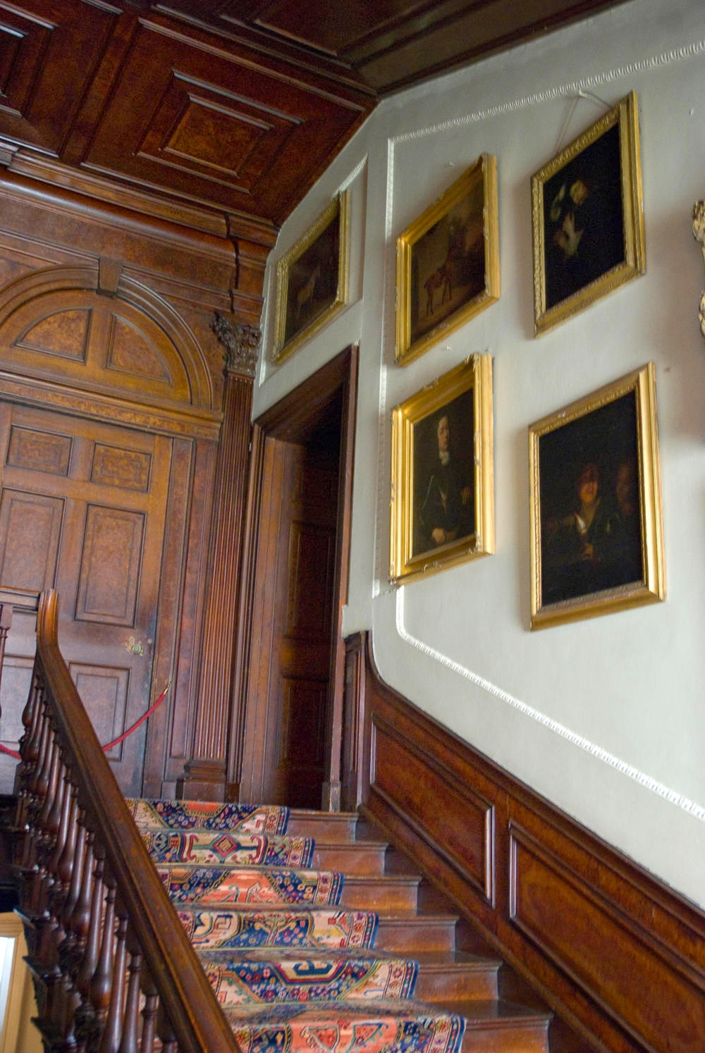 Family portraits on the stairway. Credit Thomas Quine