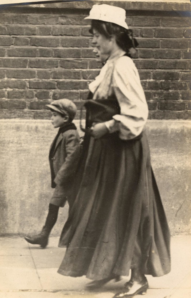The wonderful thing about candid photography is capturing people smiling, which they didn't do for portraits, 1907