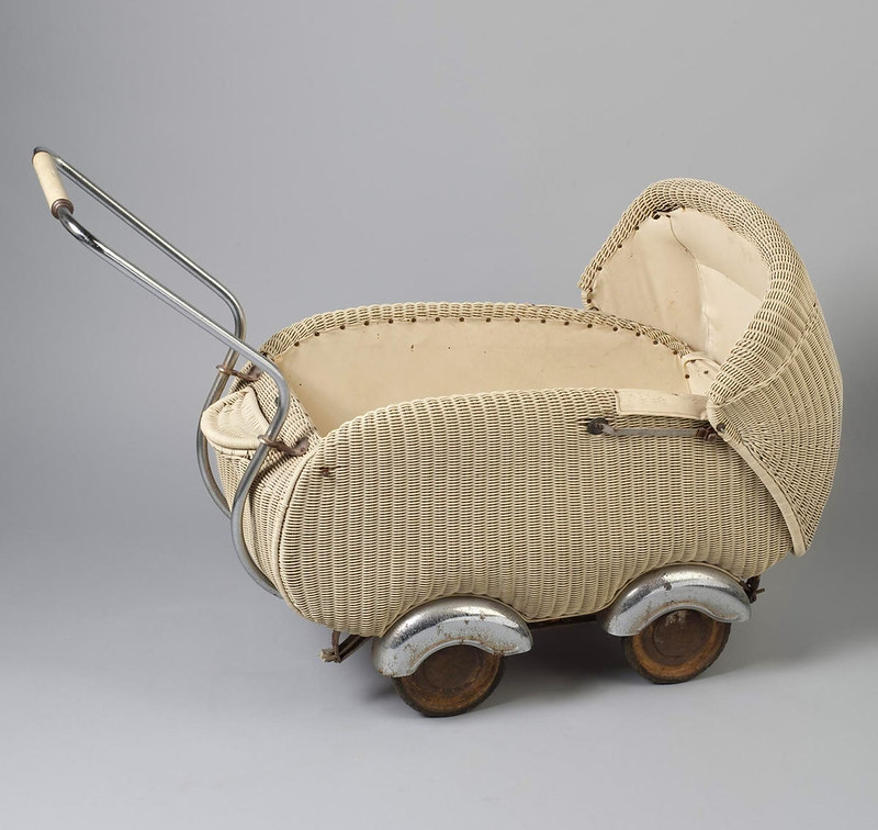 1930s German perambulator. Wickerwork with hardboard, wood, chromium plated metal, rubber composition. V&A museum