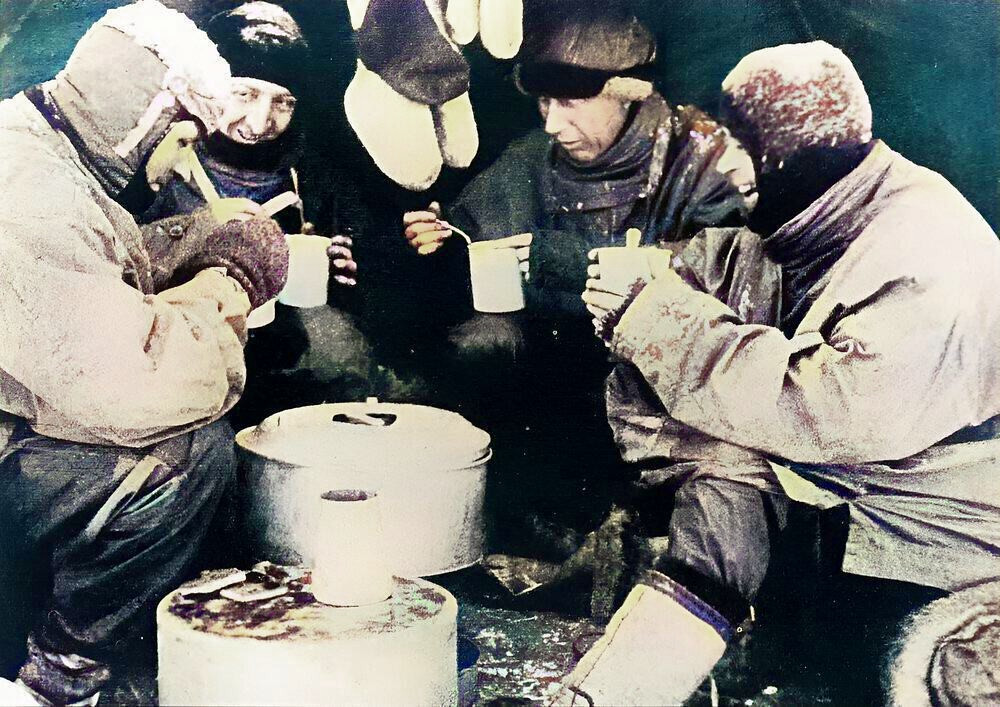 Mealtime during the Terra Nova Expedition. From left to right - Evans, Bowers, Wilson and Scott