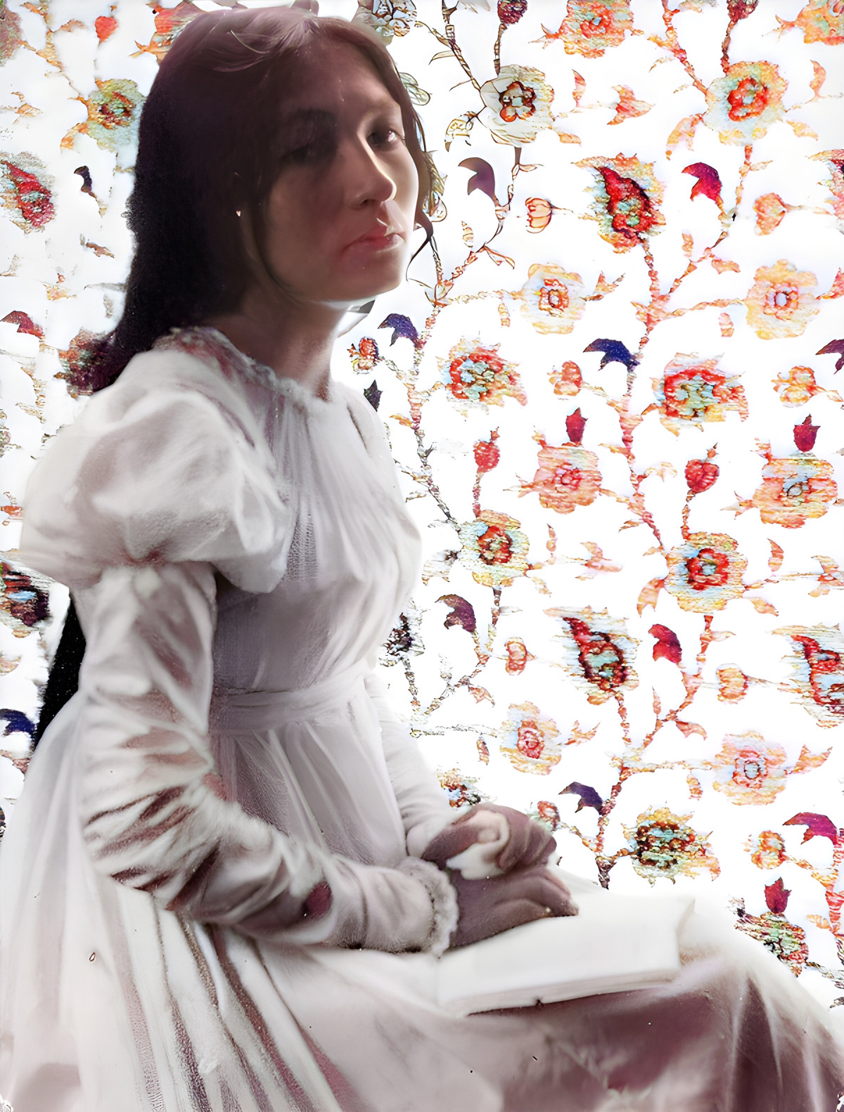 Zitkala Sa holds either her violin or a book, indicating her interests