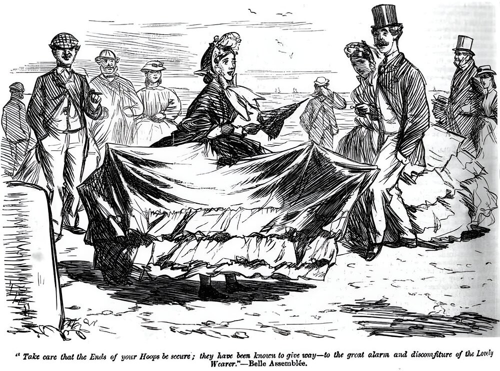 A fashionably dressed woman is shown with her skirt distorted due to the snapping of several of the hoops that supported her crinoline, much to the amusement of men and women looking on.