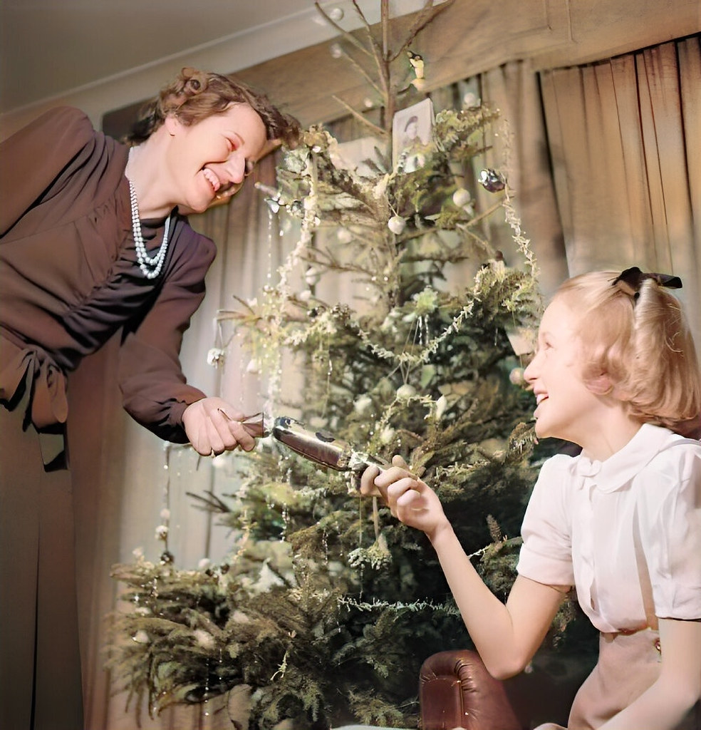 Trooper Devereux, whose photograph can be seen on the Christmas tree, is serving in Italy and bought the tree as a present for 12 year old Jean under a YMCA scheme