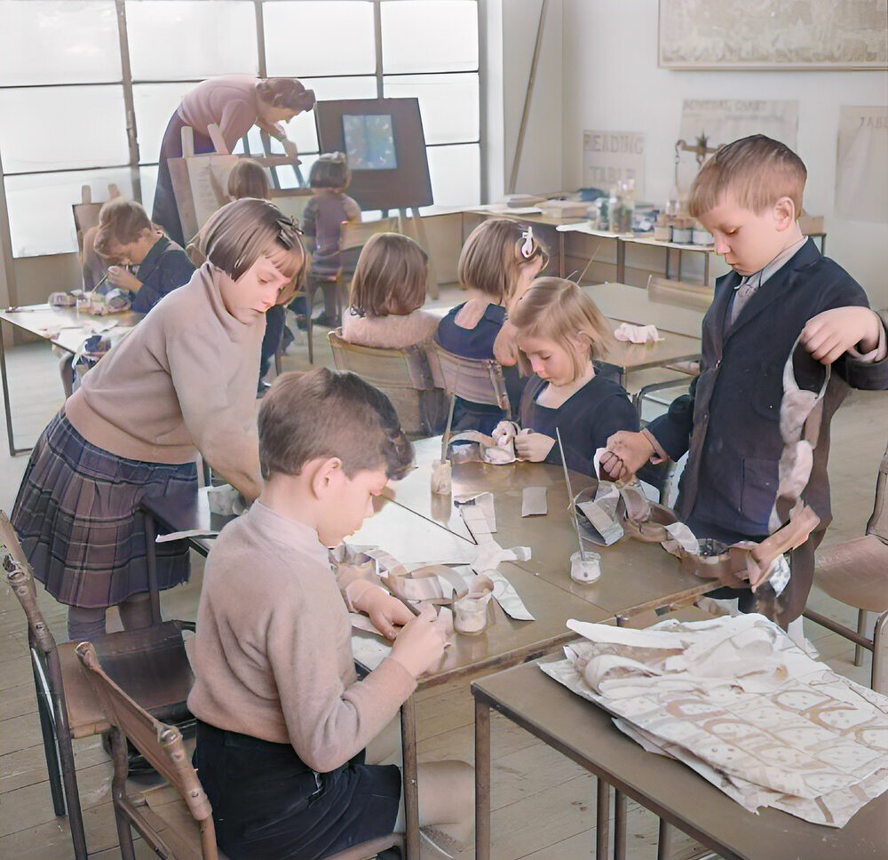 A group of young children at Junior School design and make their own Christmas decorations in Cambridgeshire, England, 1944