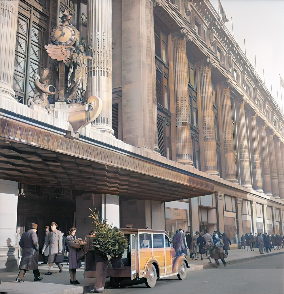 Outside the main entrance to Selfridge's department store on Oxford Street, representatives of the YMCA load the Christmas tree they have just purchased into their van