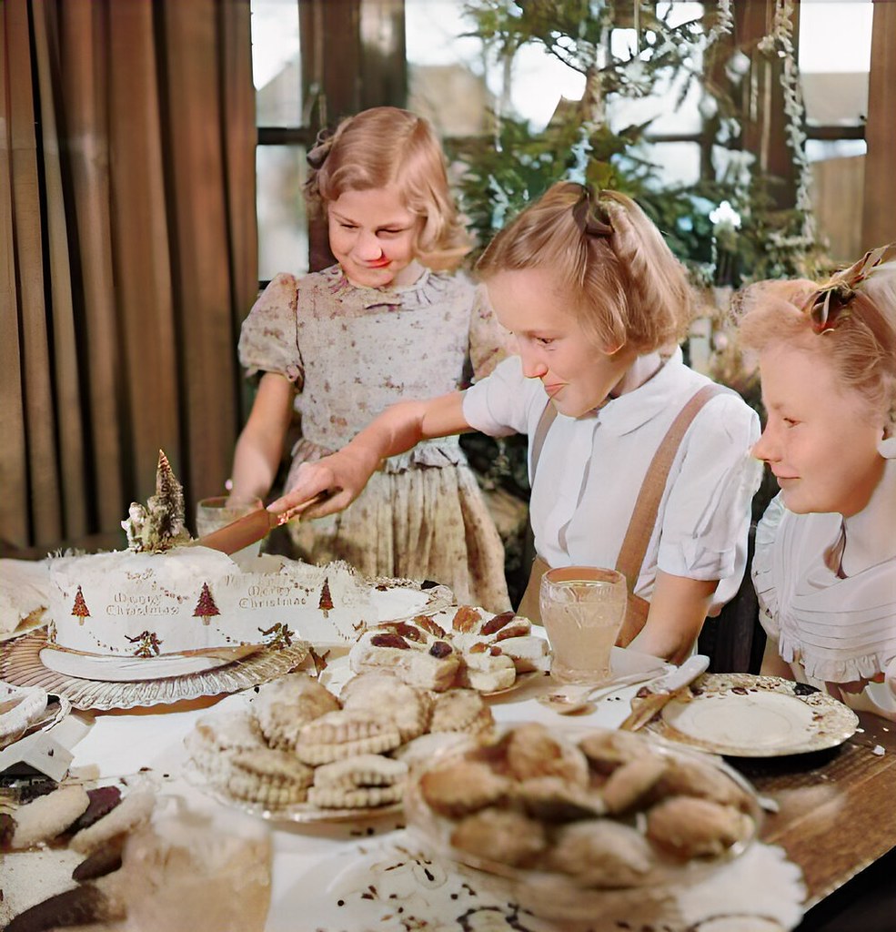 Jean Devereux cuts the cake in her house in Pinner, Middlesex, on Christmas Day 1944