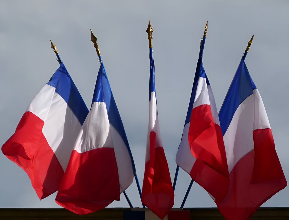Multiple French flags as commonly flown from public buildings